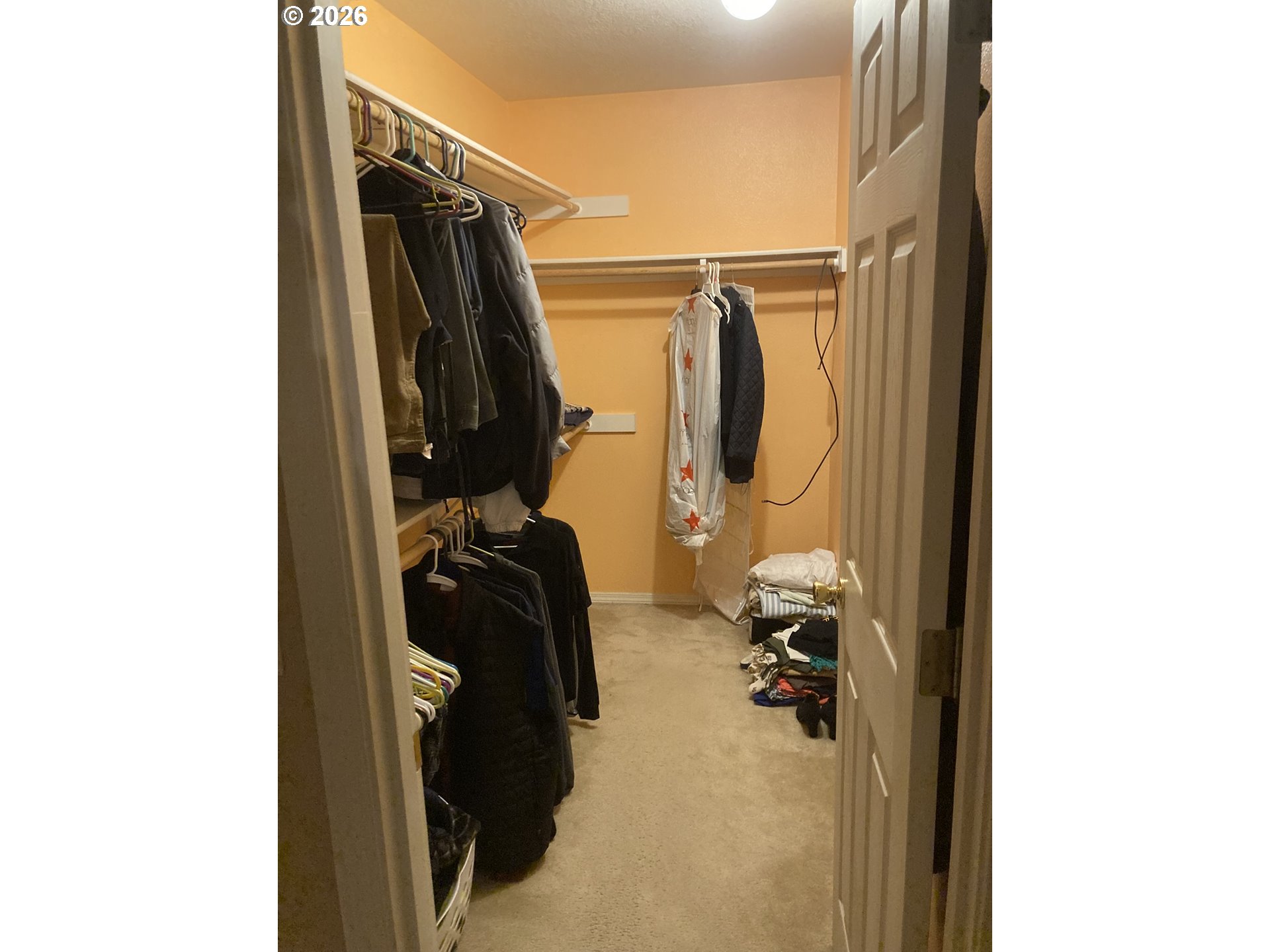 2499 North Holladay Street Cornelius, OR 97113 - Photo 13 of 26 a view of walk in closet with clothes and shoes