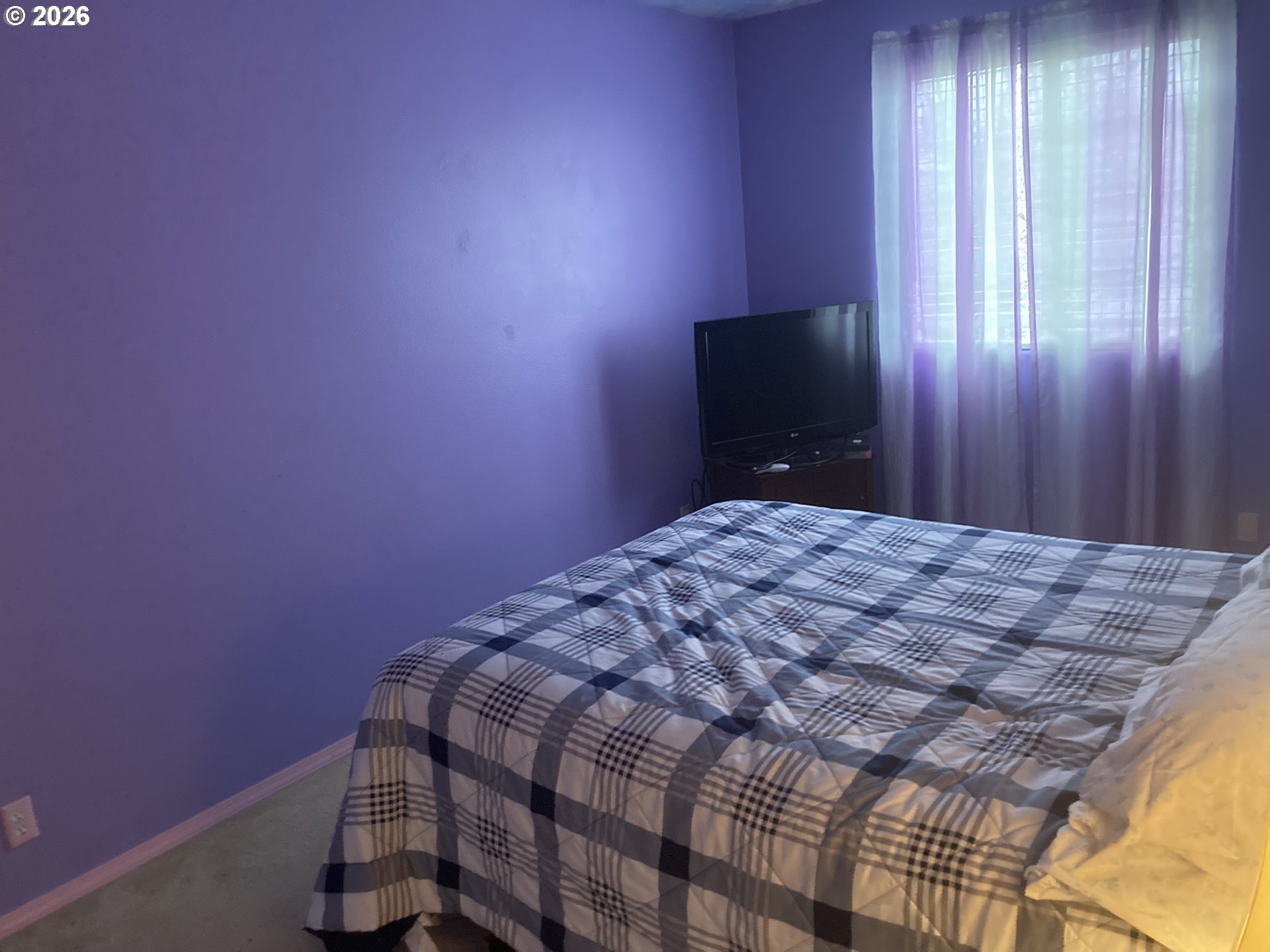 2499 North Holladay Street Cornelius, OR 97113 - Photo 17 of 26 a bedroom with a bed and a window