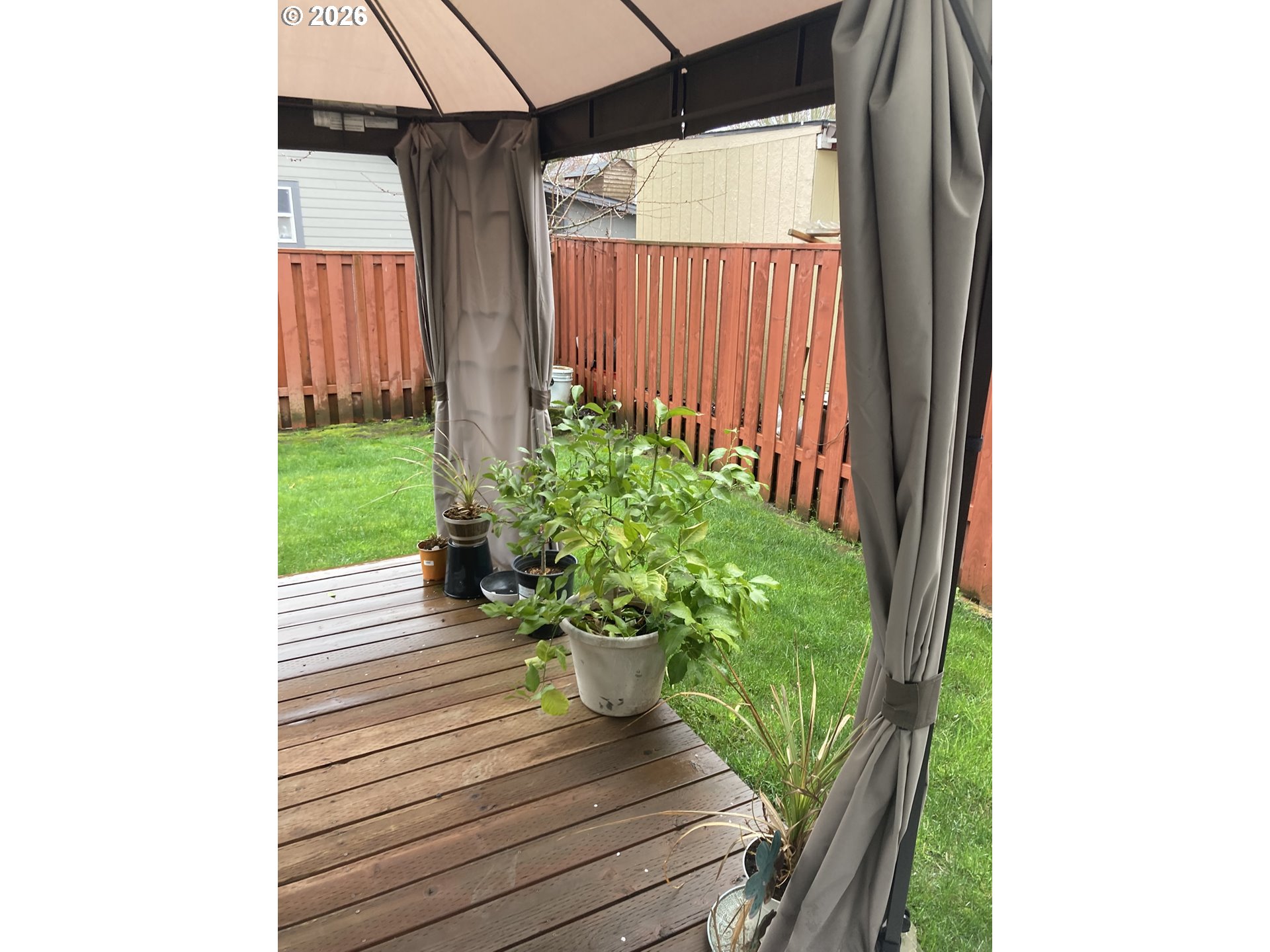 2499 North Holladay Street Cornelius, OR 97113 - Photo 22 of 26 a view of a porch with a chair and a potted plants