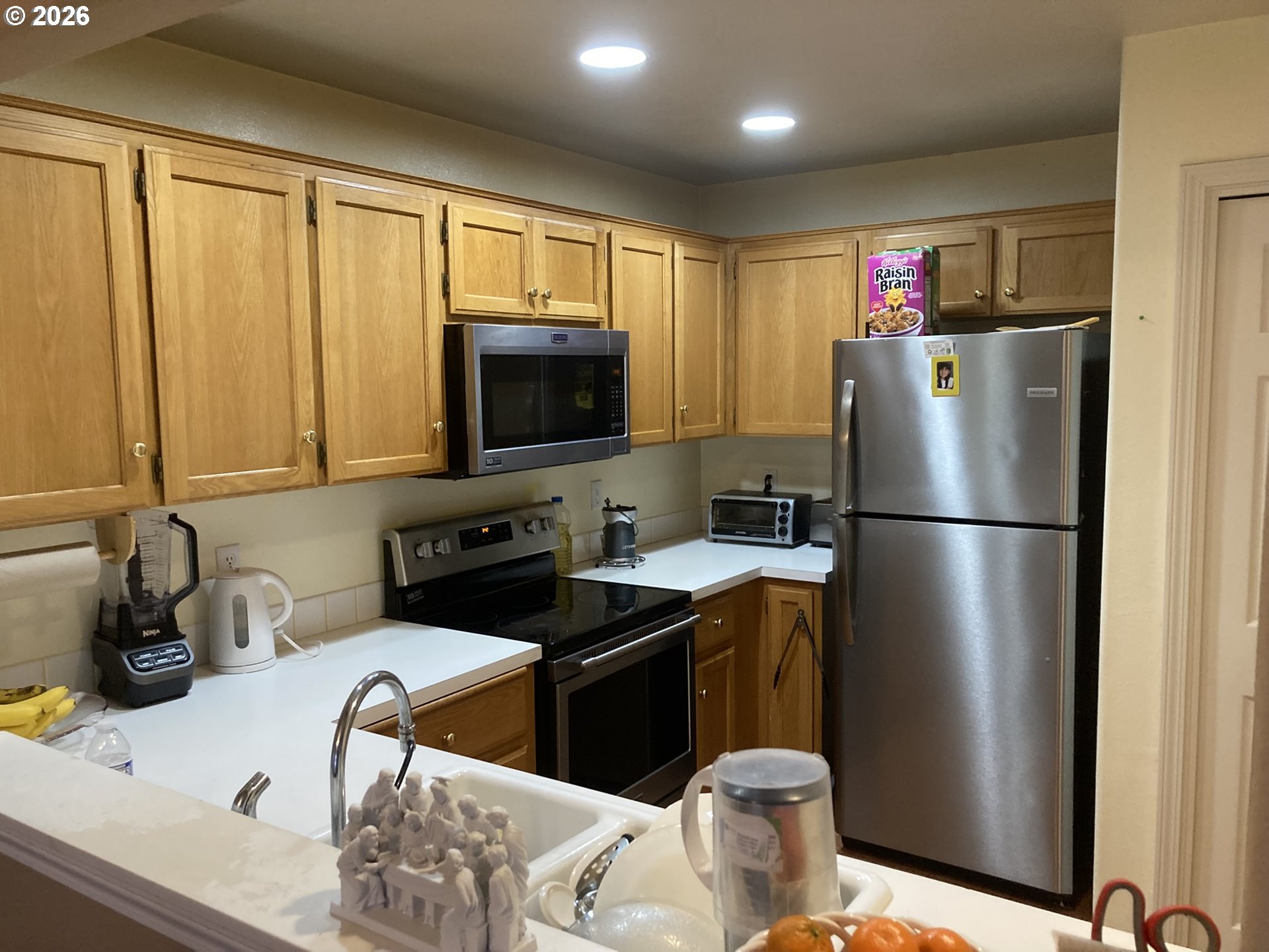 2499 North Holladay Street Cornelius, OR 97113 - Photo 4 of 26 a kitchen with stainless steel appliances granite countertop a refrigerator a stove a sink dishwasher and a refrigerator with wooden floor