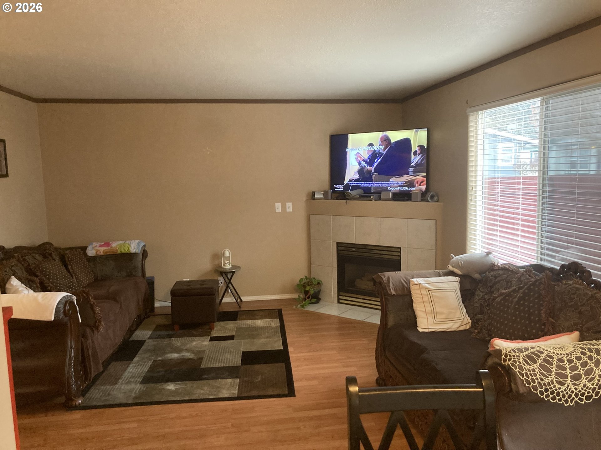 2499 North Holladay Street Cornelius, OR 97113 - Photo 5 of 26 a living room with furniture a fireplace and a flat screen tv