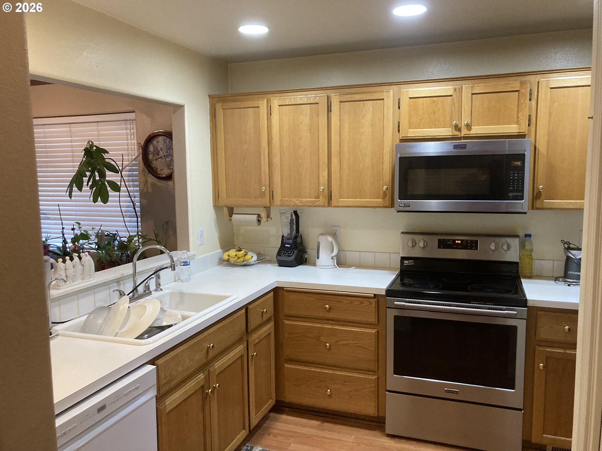 2499 North Holladay Street Cornelius, OR 97113 - Photo 7 of 26 a kitchen with a sink stove and microwave