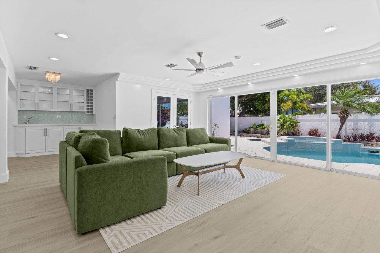 2611 Northeast 49th Street Lighthouse Point, FL 33064 - Photo 18 of 56 living room, master entry & wet bar