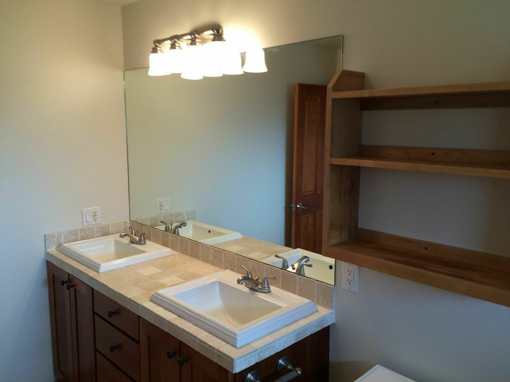 851 Peahi Road Haiku, HI 96708 - Photo 21 of 30 a bathroom with a sink and a mirror