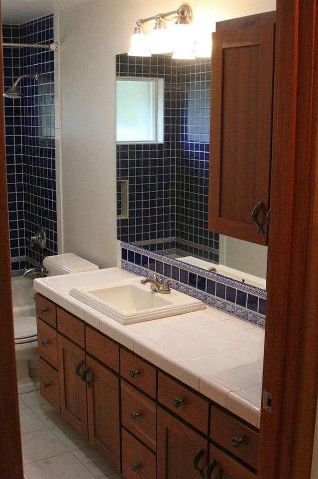 851 Peahi Road Haiku, HI 96708 - Photo 28 of 30 a bathroom with a sink and a mirror