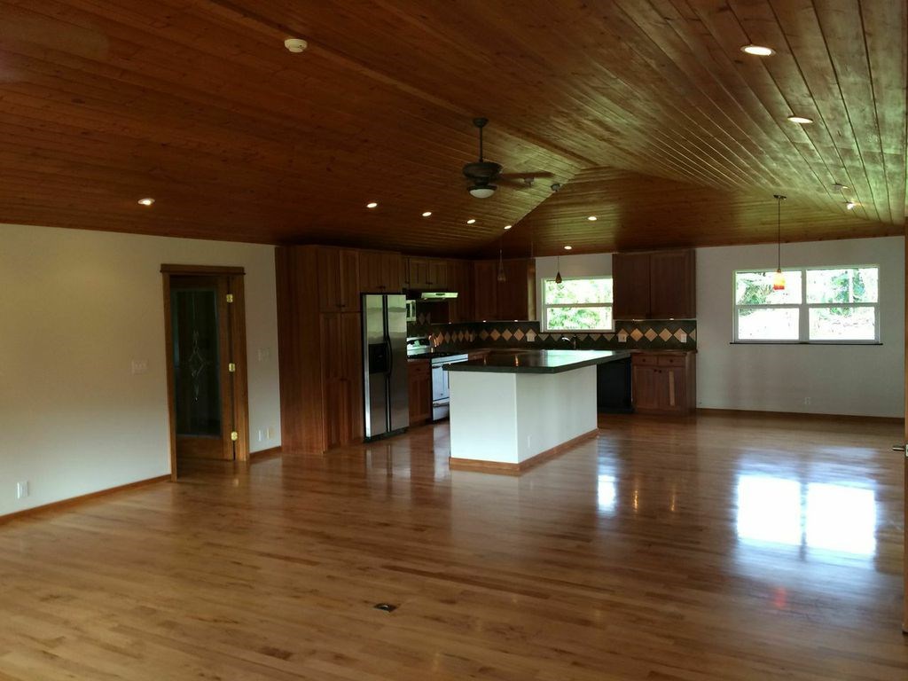 851 Peahi Road Haiku, HI 96708 - Photo 4 of 30 a view of a living room kitchen with a sink and a large window
