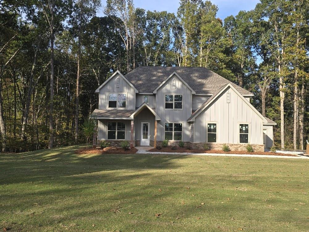 1080 Gardner Road Stockbridge, GA 30281 - Photo 1 of 1 a front view of a house with a garden