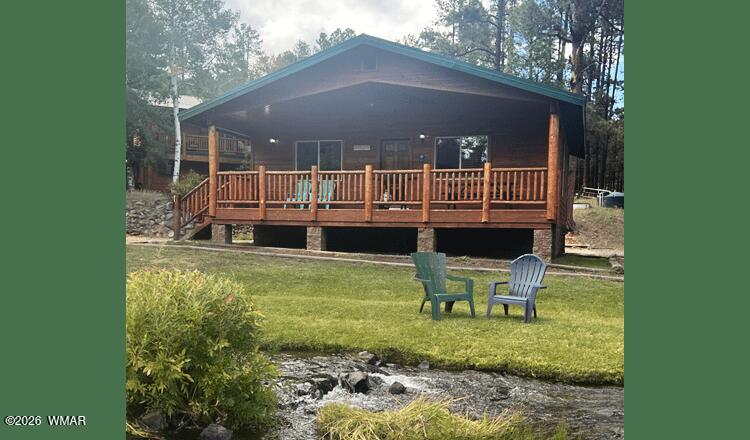 94 Main Street Greer, AZ 85927 - Photo 1 of 10 a view of a chair and tables in the patio