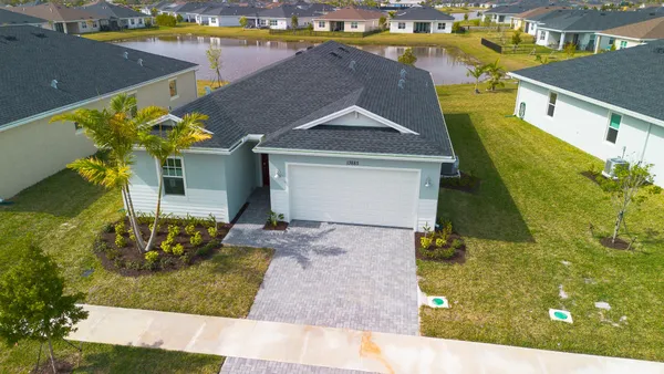 an aerial view of a house with swimming pool