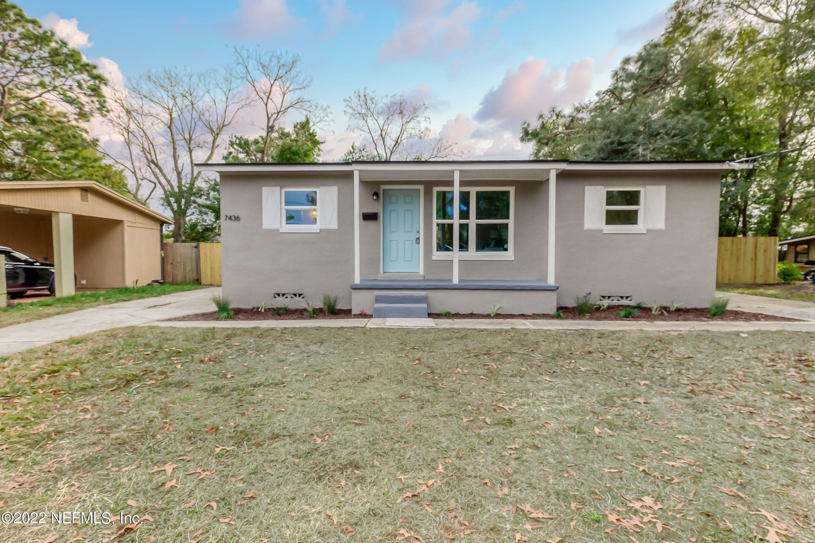7436 Bamberg Road Jacksonville, FL 32277 - Photo 1 of 28 front view of house with a yard