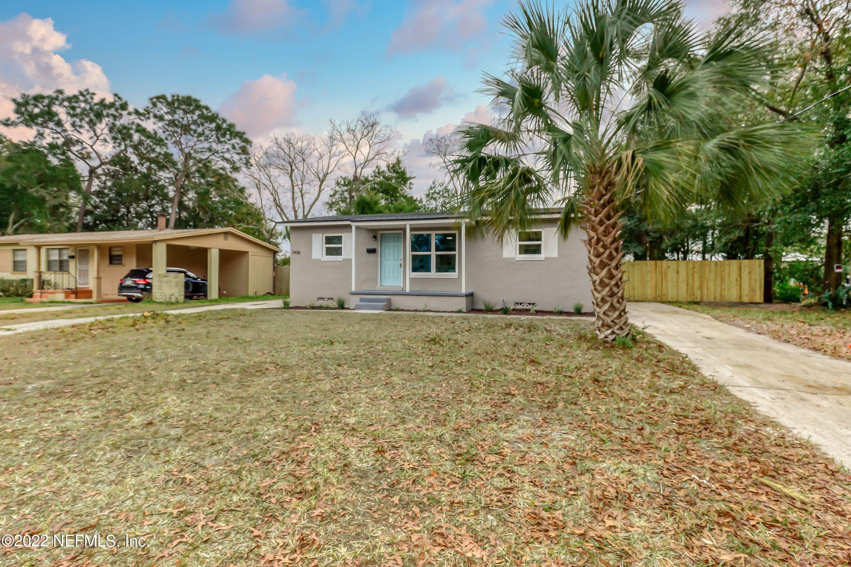 7436 Bamberg Road Jacksonville, FL 32277 - Photo 5 of 28 front view of house with a yard