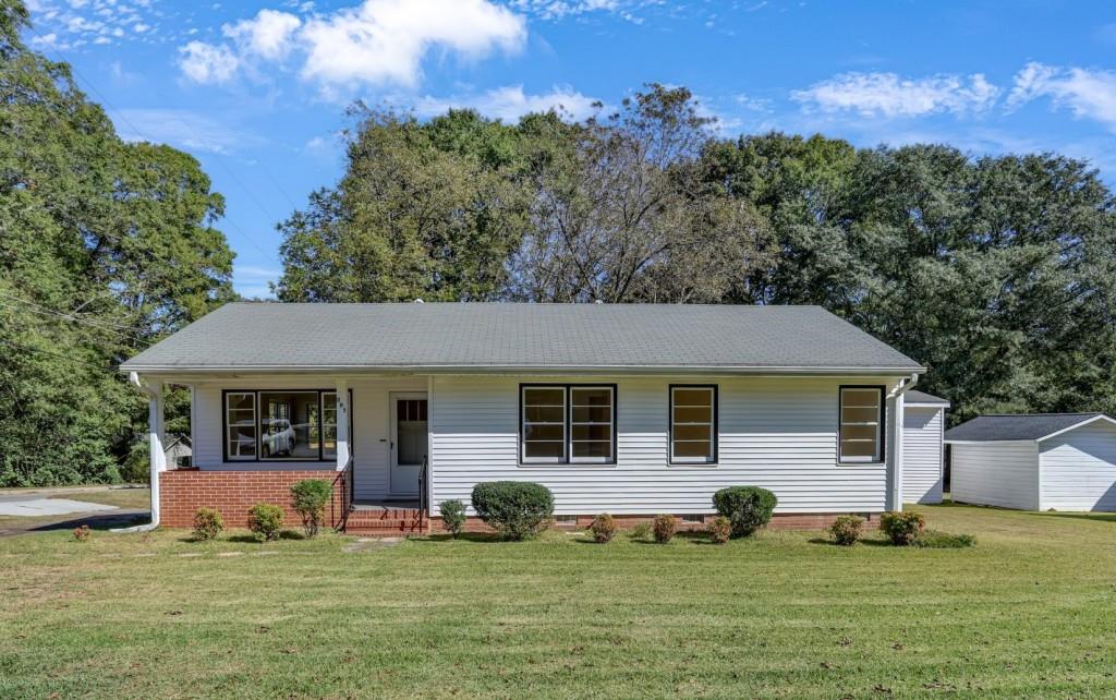 a front view of a house with a yard