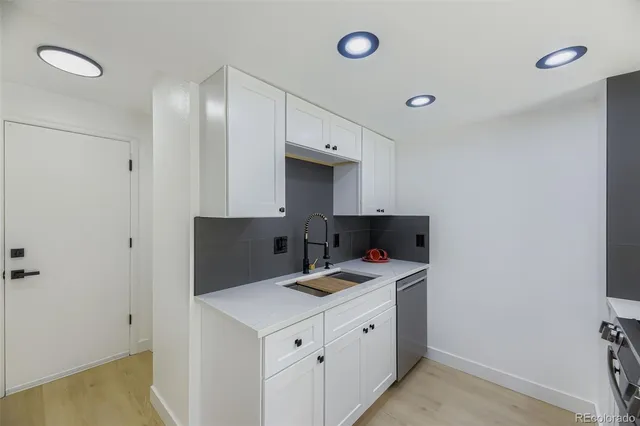 a bathroom with a sink vanity and mirror