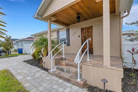 a kitchen with stainless steel appliances kitchen island granite countertop a sink a counter top space and cabinets