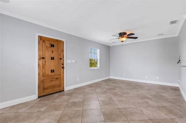 a kitchen with kitchen island granite countertop a stove and a refrigerator