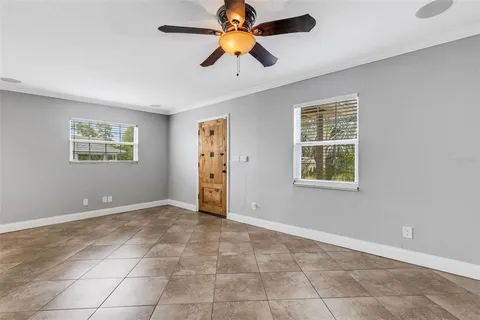 a kitchen with refrigerator and cabinets