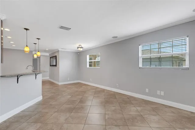 a kitchen with stainless steel appliances granite countertop a stove refrigerator sink and dishwasher
