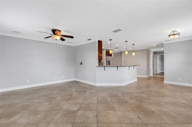 a kitchen with a stove sink and cabinets
