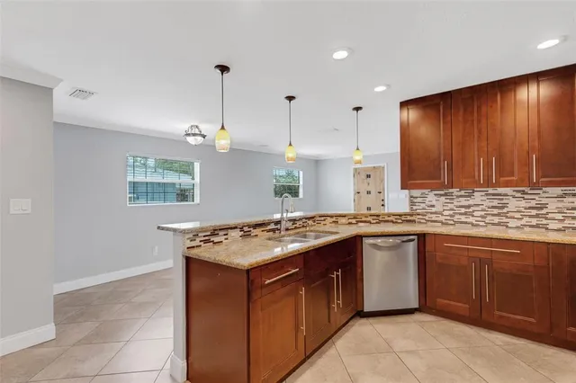 a bathroom with a double vanity sink toilet and a mirror