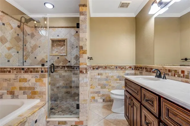 a kitchen with granite countertop cabinets and window