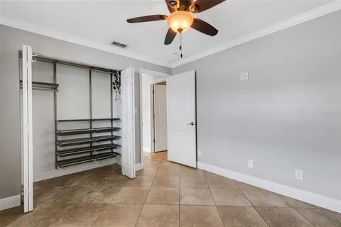a view of a dining room with furniture and a chandelier