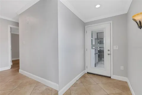 a kitchen with granite countertop a sink a stove and refrigerator