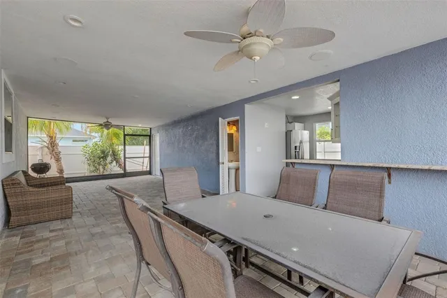 a view of a livingroom with furniture and a ceiling fan