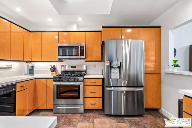 a sink with a window and wooden floor