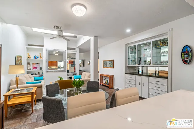 a kitchen with stainless steel appliances a counter top space and cabinets