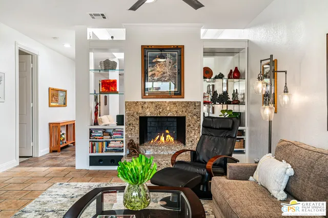 a bedroom with bed and a large window