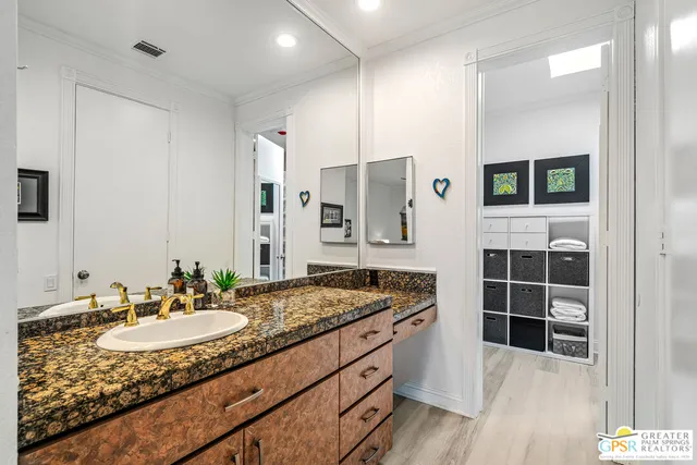 a bedroom with bed and window