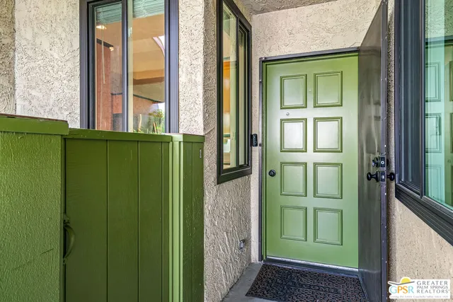 a view of swimming pool with outdoor seating and plants