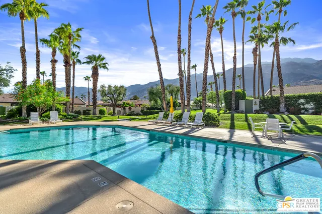 a view of a patio with table and chairs potted plants