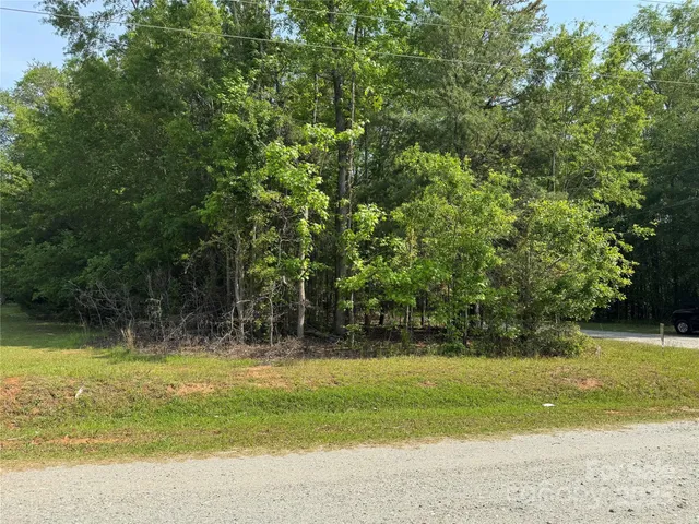 a view of outdoor space with swimming pool and green space