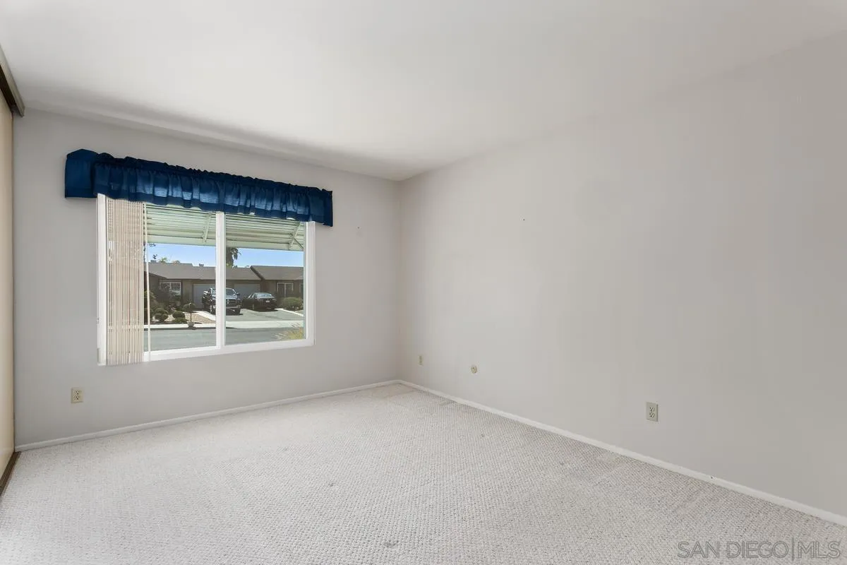 4696 Mystik Road Oceanside, CA 92056 - Photo 9 of 23 an empty room with a window
