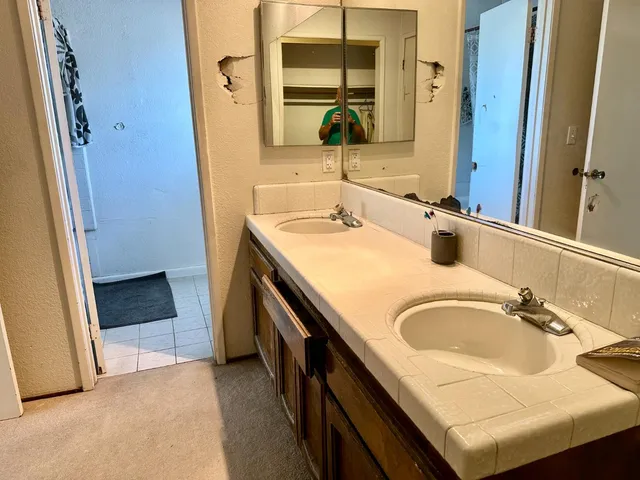 a bathroom with a sink and a mirror