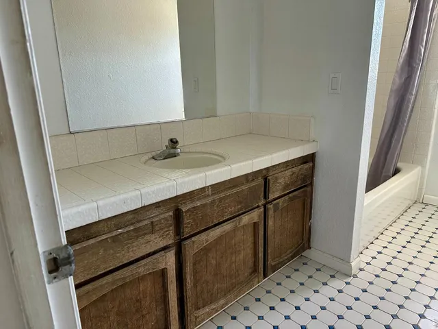 a bathroom with a sink and a mirror