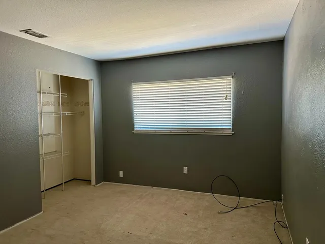 a view of a room that has a window in it