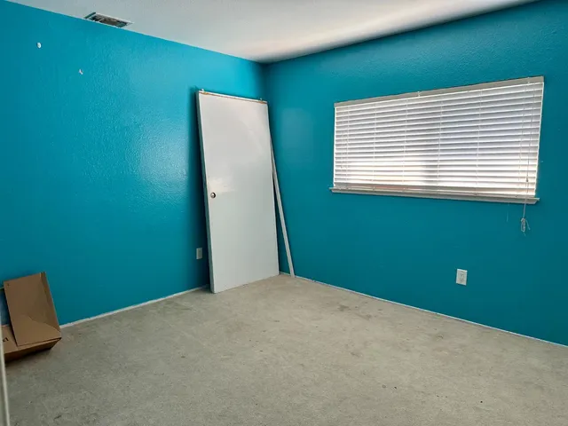 a view of a room that has a window in it