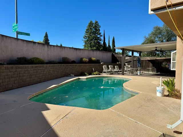 a view of a swimming pool with a patio