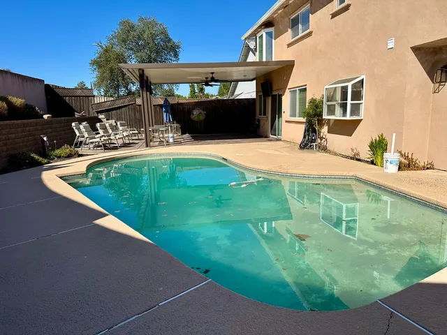 a swimming pool with a yard