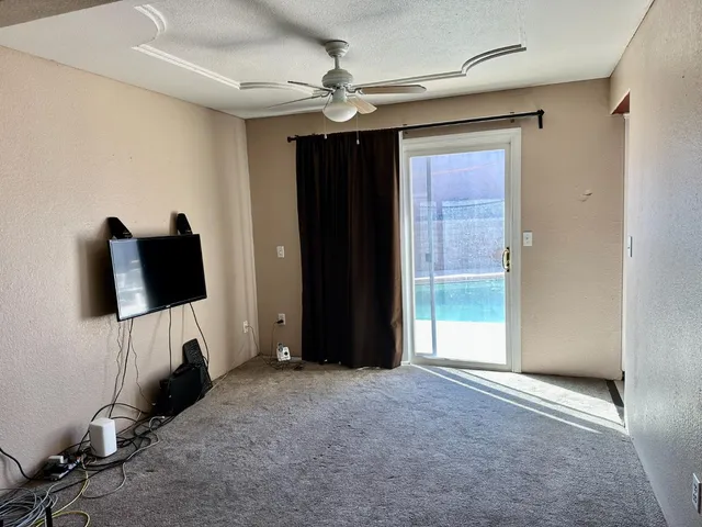 a bed room with a bed and a television