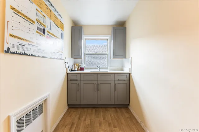 a bathroom with a sink a mirror and a window