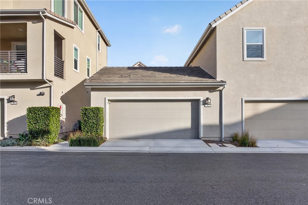 382 Chorus Irvine, CA 92618 - Photo 27 of 38 a front view of a house with a yard and garage