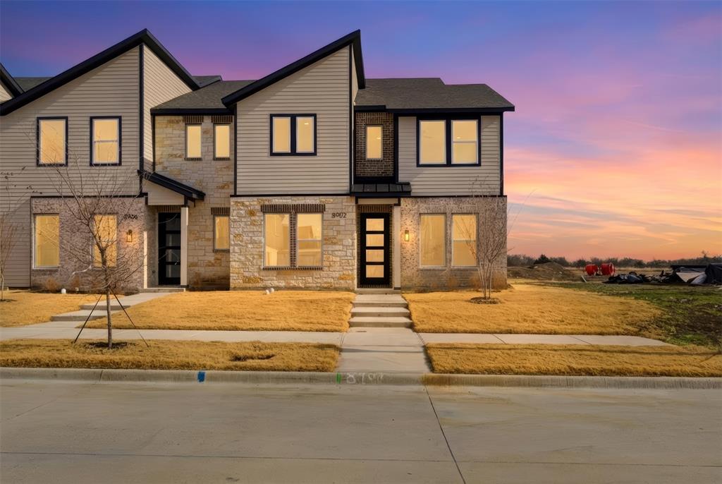 8902 Lowell Street Rowlett, TX 75089 - Photo 1 of 32 a front view of a house