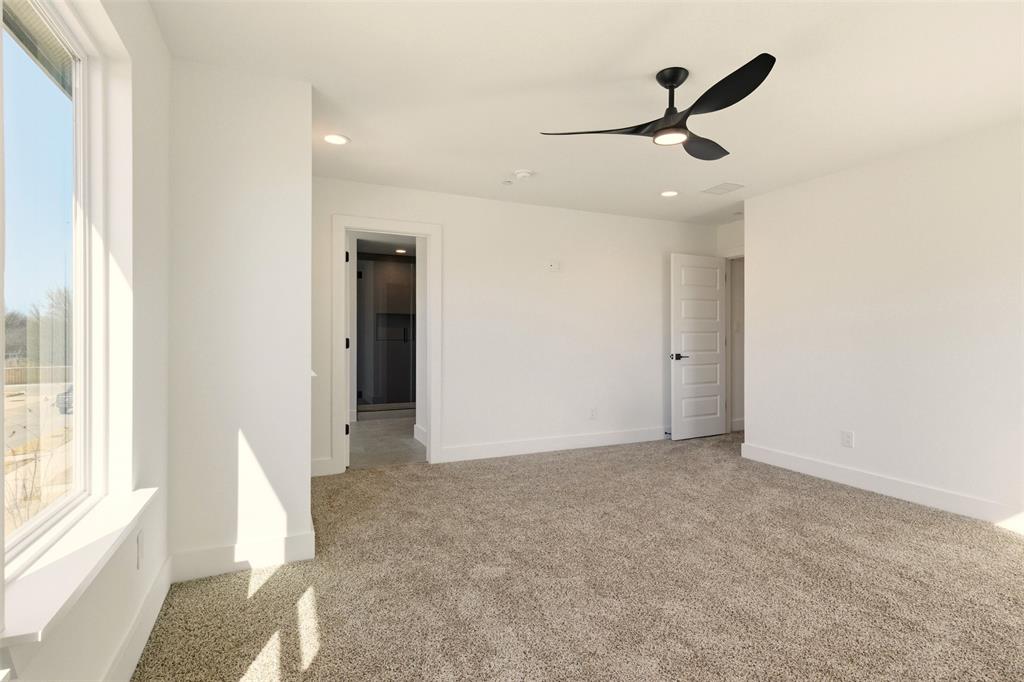8902 Lowell Street Rowlett, TX 75089 - Photo 21 of 32 a view of a livingroom with a ceiling fan and window