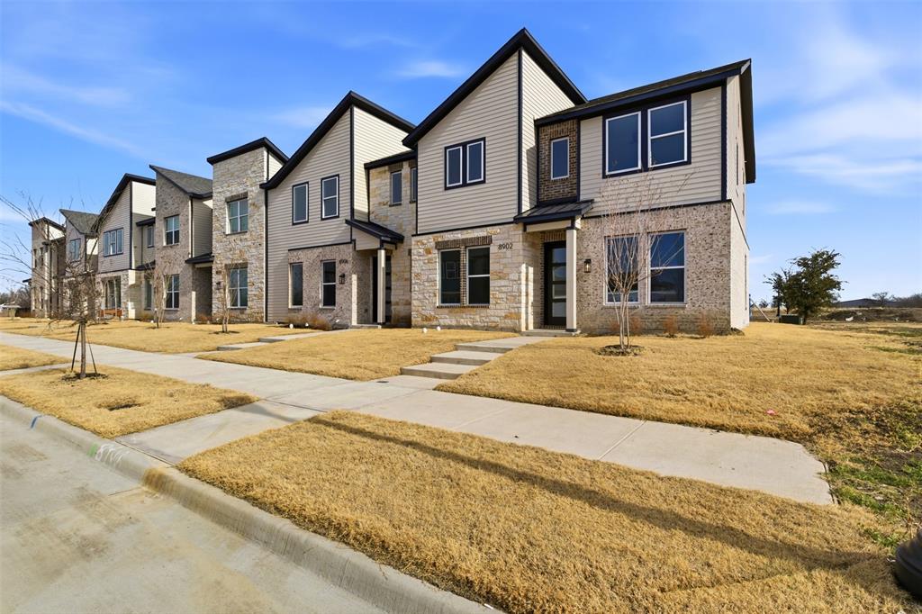 8902 Lowell Street Rowlett, TX 75089 - Photo 27 of 32 a front view of residential houses with snow on the road