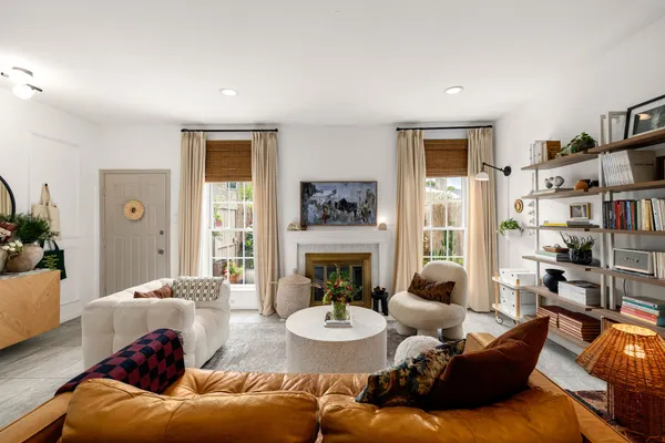 a living room with furniture and a fireplace