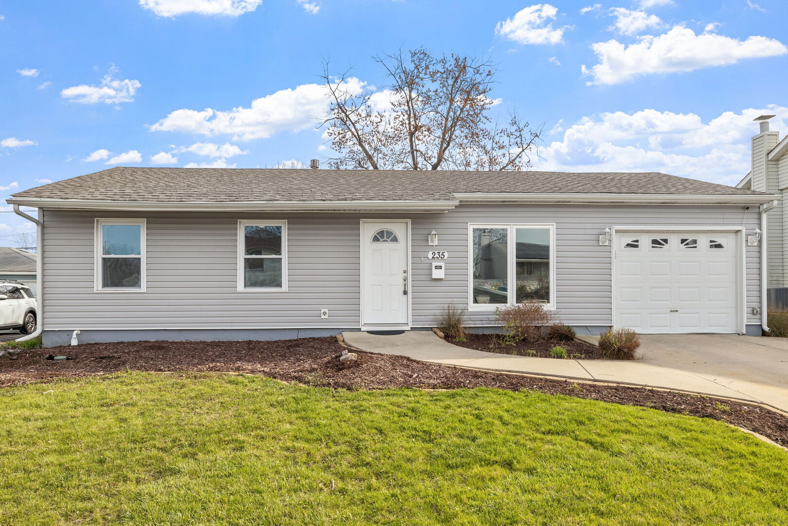 235 Murphy Drive Romeoville, IL 60446 - Photo 1 of 16 a view of a house with a patio