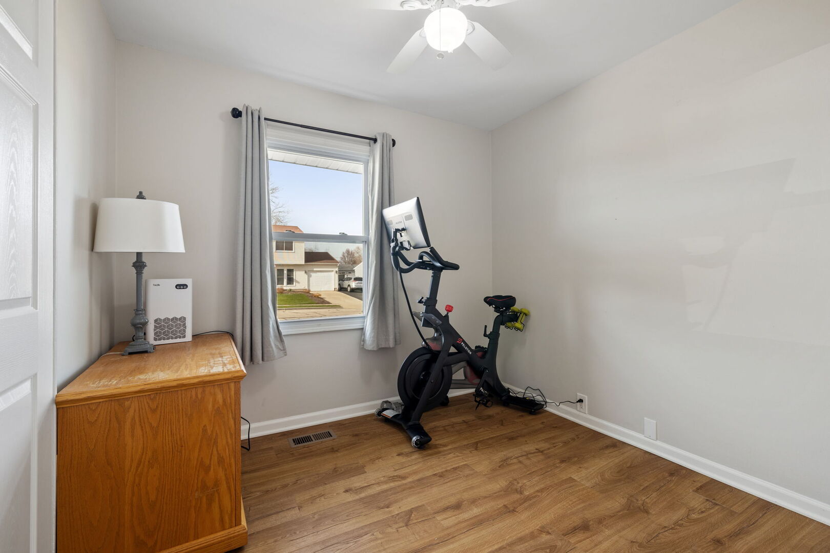 235 Murphy Drive Romeoville, IL 60446 - Photo 12 of 16 a view of workspace with wooden floor windows